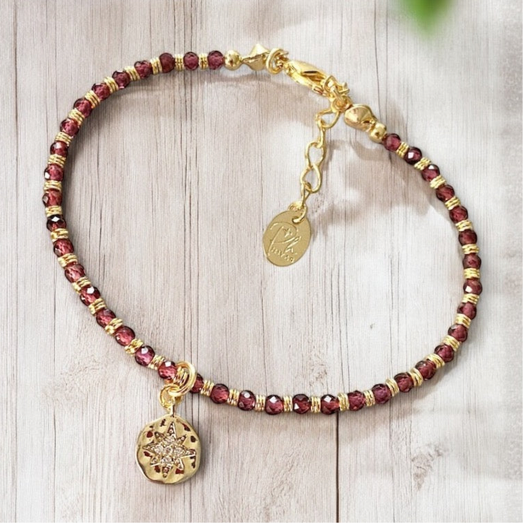 Pulsera granates estrella guía oro