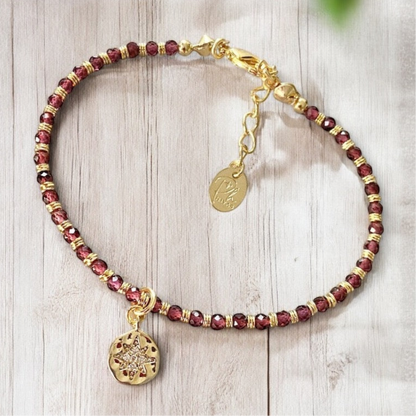 Pulsera granates estrella guía oro