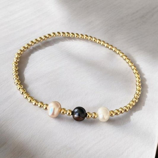 Pulsera tres perlas de río oro