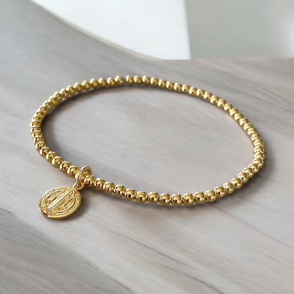 Pulsera bolitas san Benito oro