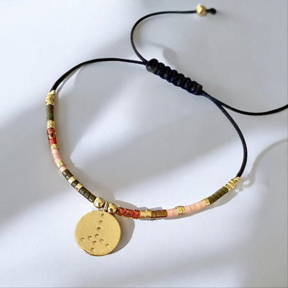 Pulsera hilo mijuki paz oro